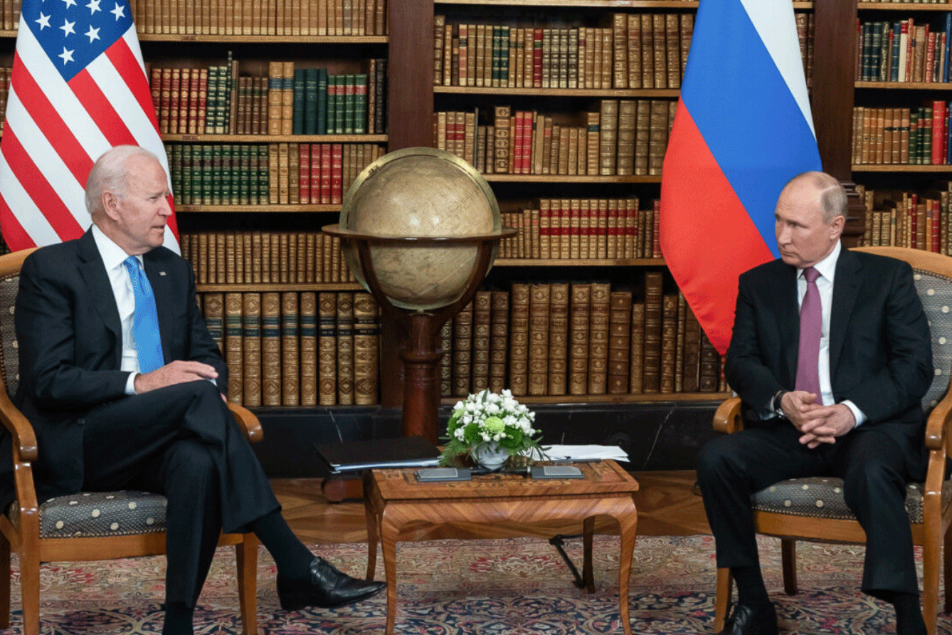 President Putin and President Biden seated and talking