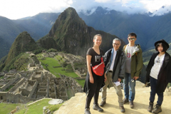 Posing with a panoramic view of Machu Picchu in Peru are (l-r) PhD student Paloma Gonzalez, Associate Professor Takehiko Nagakura, and two MIT graduate students.  Photo courtesy of MISTI